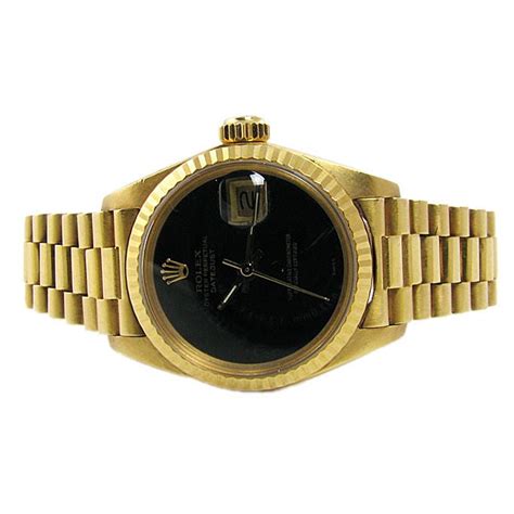 gold watch black face rolex